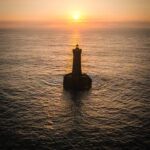 Le tour des Phares Coucher de soleil sur Le Four Lighthouse aerial dji vertical Bretagne Finistere By Tranchig